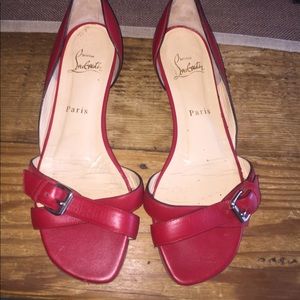 Red Louboutin flats